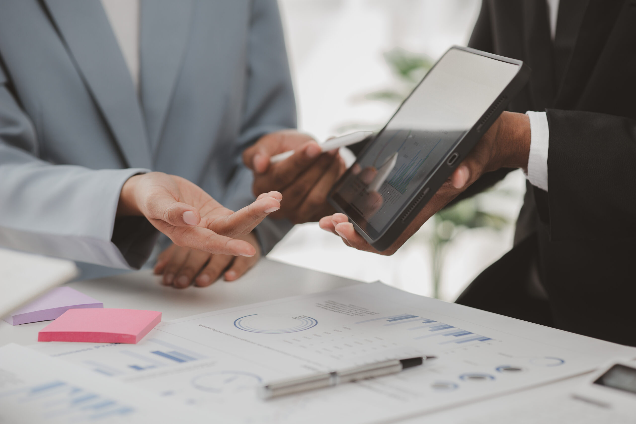 Business professionals reviewing charts and data together